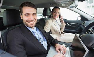 Man-and-Woman-sitting-in-a-car_EDI-on-the-road